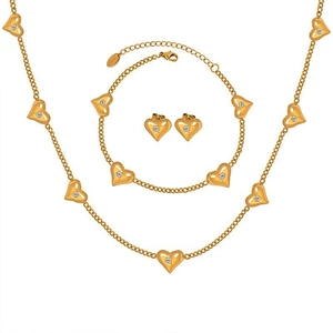 Golden heart jewelry set including necklace, bracelet and earrings with sparkling zircons