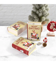 Detail of magic book-shaped Christmas gift boxes with festive reindeer and santa illustrations