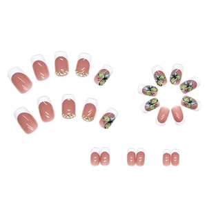 White French tip press-on nails with butterfly pattern and rhinestone accents on pink base