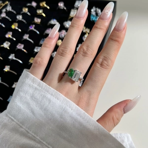 Detailed close-up of S925 silver ring featuring a green oval stone and zircon accents