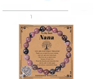 Detailed view of 8mm pink zebra stone beads and silver tree of life charm bracelet