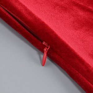 Macro view of high-grade red velvet fabric texture with hidden zipper detail