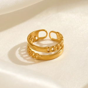 Double-layered 18K gold plated stainless steel chain ring on elegant silk background