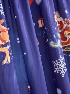 Detail of navy blue Christmas fabric with Santa Claus, reindeer, and snowflakes patterns