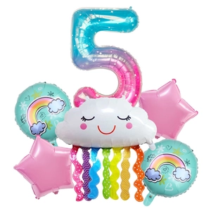 Close-up of number 5 foil balloon set with rainbow tassels and smiley cloud for birthday party