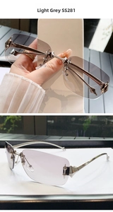Detail of light grey frameless sunglasses SS281 with silver spike metal ornaments