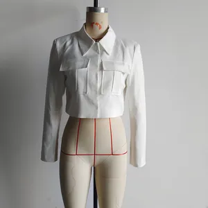 Detailed view of white cropped cargo jacket with notch lapels and flap pockets