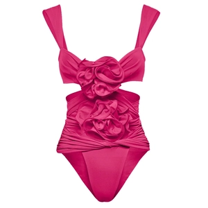Detailed view of the 3D rose embellishment and ruched texture on this fuchsia swimsuit