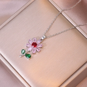 Floral zircon necklace featuring pink and red petals on a premium jewelry display box
