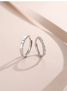 Detail of S925 sterling silver couple rings showing inner hallmark and geometric design