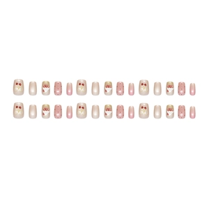 Press-on nails featuring cherry prints, polka dots, and pearls in a square-oval shape
