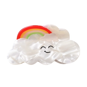 Cloud-shaped hair claw with rainbow accent and smiley face in pearl white acetate