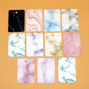 Colorful marble textured jewelry display cards for earrings and necklaces in assorted sets