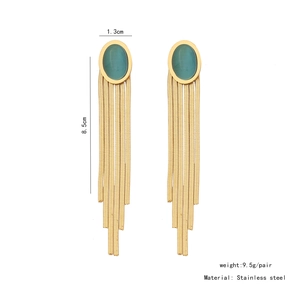 Detailed view of long gold tassel earrings with oval cat-eye stones and size dimensions