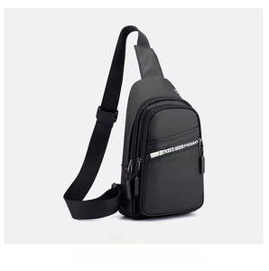 Side view of black nylon chest bag showing zipper compartments and adjustable strap