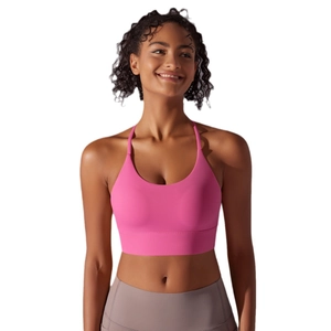 Pink double-sided nylon sports bra with cross straps for yoga and fitness