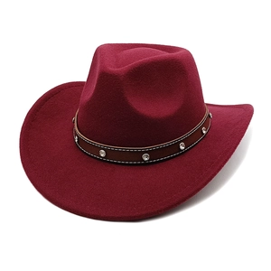 Close-up of burgundy wool felt cowboy hat with studded brown leather band