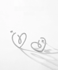 Close-up of S925 sterling silver heart earrings with micro-set white zircon stones