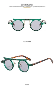 Detail of vintage round sunglasses in green frame with star metal accents and grey lenses