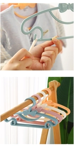Close-up of baby plastic hangers in macaron colors with non-slip bow hooks