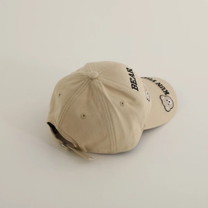 Detailed embroidery of BEAR text and cartoon bear print on beige kids cotton baseball cap