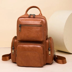 Detailed close-up showing the premium PU leather texture and multi-layer zippers of the bag