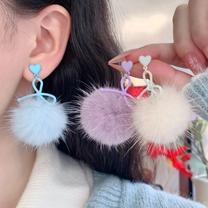 Chic velvet pompom bow earrings in blue, purple, and cream for autumn and winter fashion