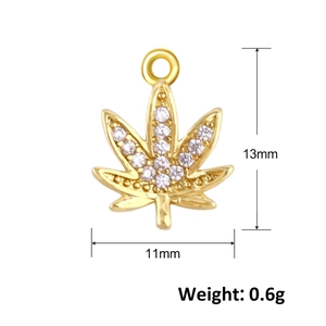 Macro view of gold-plated leaf pendant with white cubic zirconia measuring 13mm by 11mm