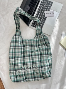 Green and cream checkered canvas tote bag with embroidered star and minimalist design