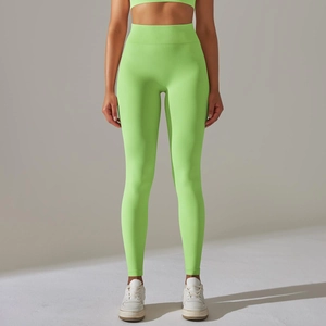 Detailed texture of seamless high-waist neon green yoga leggings with tummy control