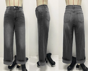 Detail view of high waist straight jeans with wide rolled cuffs in dark grey denim