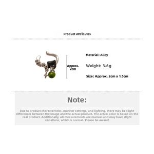 Detail showing retro silver alloy ear cuff with green bead and black cubic charms, 3.6g