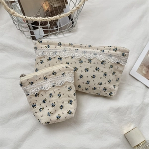 Detailed set of floral storage bags with white lace trim and blue flower patterns