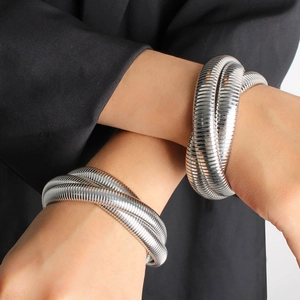 Three-layer silver elastic snake bone bracelet in minimalist stainless steel finish
