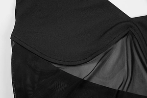 Detail of the V-shaped stitching between solid black fabric and sheer mesh material