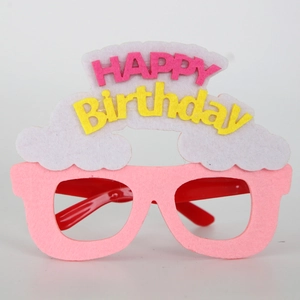 Detailed close-up of pink felt Happy Birthday glasses frame with white cloud decor