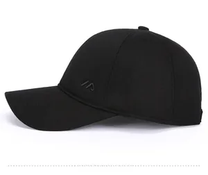 Side view detail of a black winter baseball cap featuring grey embroidery and ear flaps