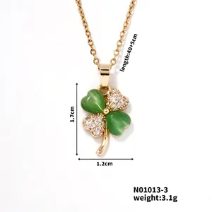 Detail showing clover pendant dimensions 1.7x1.2cm with green stones and zircons