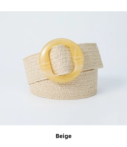 Detailed view of beige straw woven elastic belt with amber-textured resin round buckle