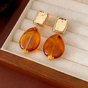 Vintage style drop earrings with amber waterdrop pendant and square gold metal top