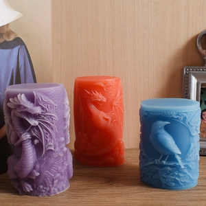 Detail view of cylindrical silicone mold showing embossed dragon and bird textures