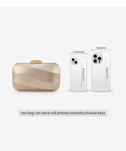 Size comparison of champagne gold evening clutch bag with smartphones and dimensions