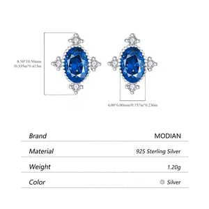 Vintage s925 silver stud earrings featuring oval blue zircon and small white diamonds