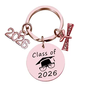 Detail of rose gold Class of 2026 graduation keychain with scroll and year charms