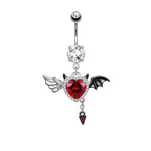 Detailed shot of devil heart belly ring with red gemstone and black bat wing charms