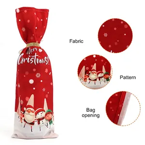 Christmas wine bottle cover with red Santa Claus print and golden drawstring closure