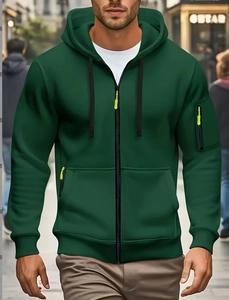Detailed view of dark green men's zip hoodie with fluorescent green zipper pull and pockets