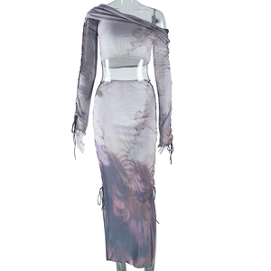 Close-up of mesh fabric texture with purple artistic print and side drawstring detail