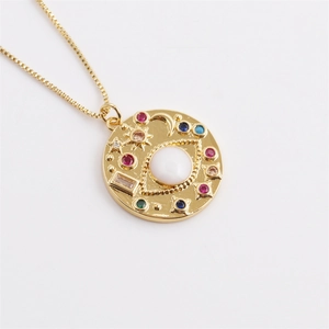 Gold evil eye necklace with colorful gemstones and star crescent moon engravings