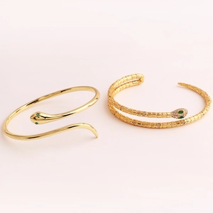 Detailed comparison of minimalist gold snake bangle and crystal pavé snake bracelet set